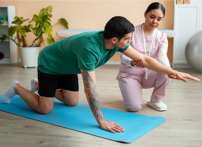 Licensed physical therapist guiding a patient through corrective exercises at Flexify Physical Therapy in Allen, TX to improve posture, balance, and movement.