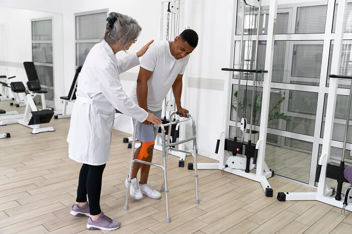 Physical therapist assisting a patient with post-operative and surgical rehabilitation exercises at Flexify Physical Therapy in Allen, TX to regain strength and mobility.