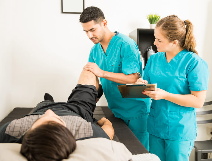 Physical therapist performing manual therapy and joint manipulation on a patient at Flexify Physical Therapy in Allen, TX to relieve pain and restore mobility.